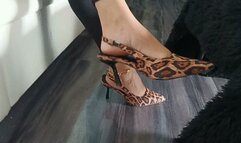 Wonderful woman keeps her stiletto heels dangling on her feet (8)