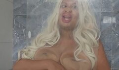 Blondie gets face and boobs stuck in the glass