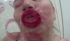 Red kissing sexy puffy lips on glass a
