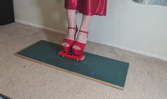 Giantess Lily Kink toy car crush of a 67 Chevelle SS in big mega red heels and stomping the bits in a box high right view