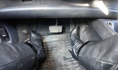 driving in leather high heel boots and leather outfit