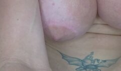 Busty milf plays with two dildos in the bathroom