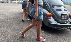 The girls are driving a beat-up Beetle in Converse sneakers—Jarlyn and Dalilah