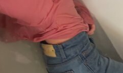 Pink Longshirt, jeans, white socks in bathtub