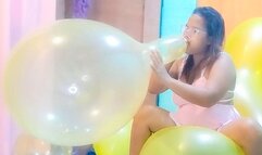 Sexy Juju Blows To Pop 2 Big Balloons While Riding A Huge Yellow Doll Balloon