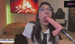 Flight attendant on her knees sucks a large dildo