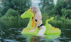 Hot fucking of a squeaky inflatable medieval dragon on a lake
