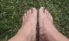 Pulling off my shoes and socks outside in the sun. Showing my gorgeous male feet.