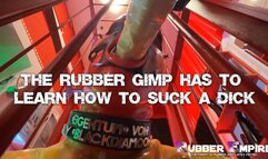 The Rubber Gimp has to learn how to suck a dick