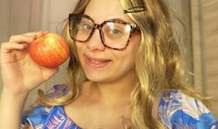 Blonde girl with glasses makes an ASMR video of herself eating