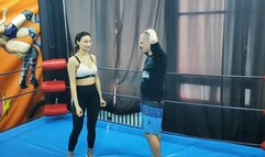 Karateka girl wrestles a guy