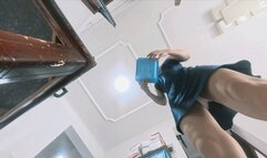 The female giant cleaning up the garbage from a first-person perspective
