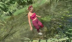 Wetlook in the river in tight outfit!