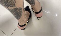 elegant little feet in black heels
