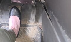 Evalynn flooring the pedal in black flats