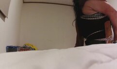 Crossdresser tied in chair in denin shorts