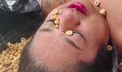 Masala enjoys her cereal and milk on her face!