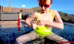 Red XXX fucks her pussy with a toy in the pool