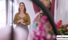 Curvy photographer rimmed by a florist