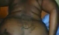 Presenting her fat inked ass.