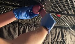 Milking table handjob with rubber gloves.