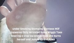 under Smoking Stomping Giantess Milf Unawares Dirty Wrinkled Soles Wiggly Toes wearing a crop top and panties she burns herself and Jumps up and down