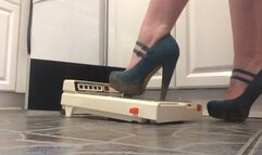 Teal strappy heels with metal tip destroy historic pin ball game