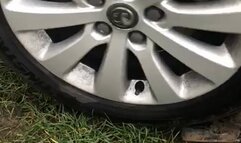 Red sole boots run over by my car in mud