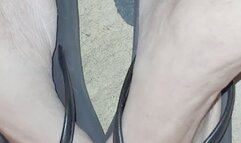 Bare toes in flip flop