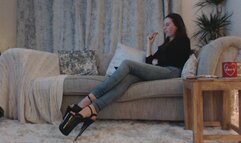 Human footstool relaxing 8 inch sandals (MOV)