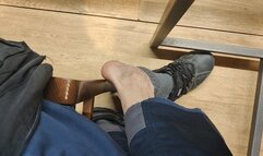 Taking off my socks and shoeplay, sitting at the table in the mall