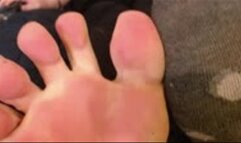 Feet show, one sock on one sock off