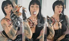 Human ashtray wearing PVC and Leather gloves