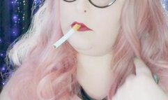 Nicki Pie chainsmoking corks in leather and stilettos