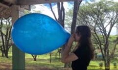 Katie Blows to Pop a Printed Unique 16" Balloon