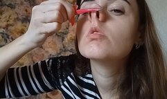 double penetration of nasal openings with tweezers