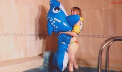 Alla blows off the blue inflatable whale in the pool and wears an inflatable vest!!!