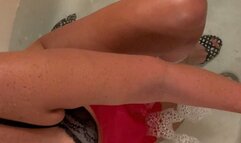 Carissa in apron, red latex gloves, and heels--the Bathtub Chronicles continue