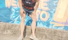 Tempest is flexing in front of mural