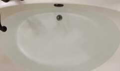 Carissa in scrubs and Cloud shoes in the bathtub--a mermaid just needs water!