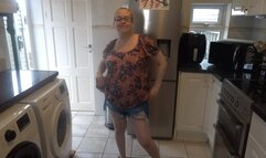 MILF stripping in shorts in the kitchen