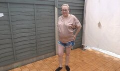 MILF stripping in shorts