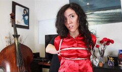 Khrystal in red satin and jeans is being held for ransom, tightly tied with ropes and ballgagged!