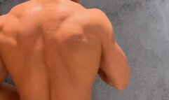 Muscular back shower scene