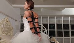 Bondage of Sofi with leather garters and bracers in a wedding dress_ Tel