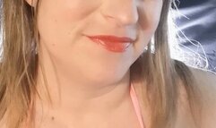 Bright make up and smoking in a fluffy bikini top