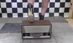 Old historical Radio crushed under high heel Boots