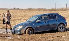 CARSTUCK Wet and muddy road to the village
