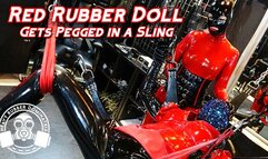 Red Rubber Doll Gets Pegged in Sling