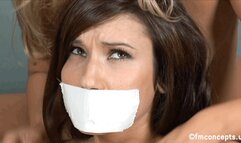 As Erin Avery lay bound and gagged on the floor, Kara Kingman played with her nearly nude body, then left Erin struggling!